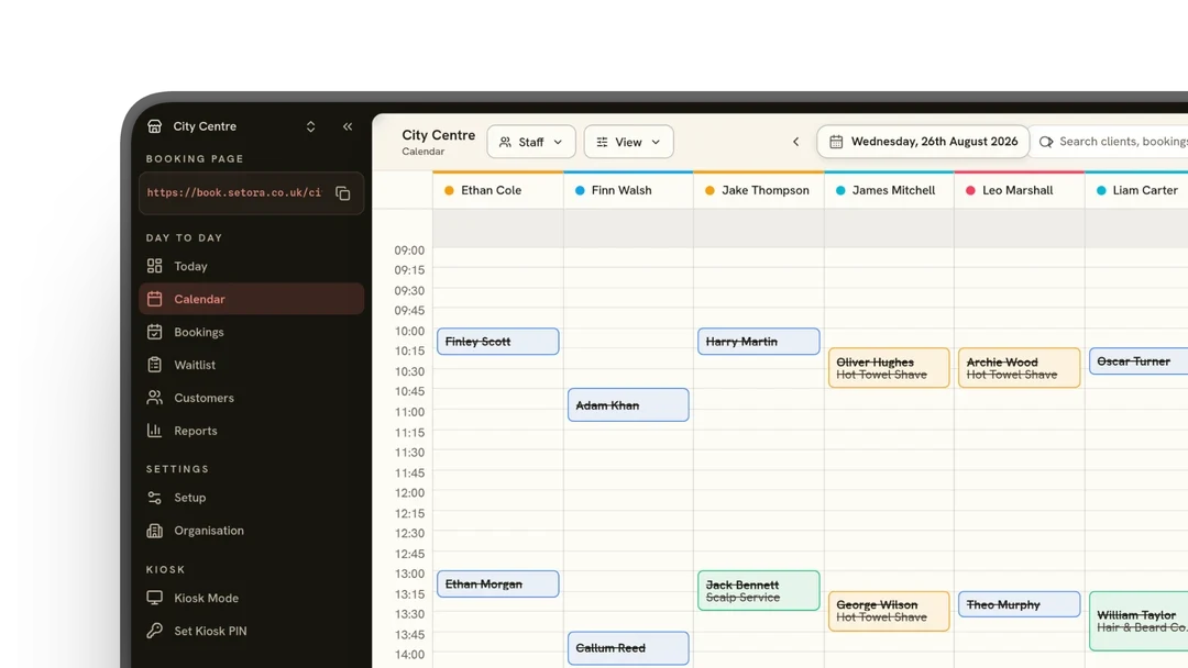 Setora booking calendar with staff columns and appointments in the day view.